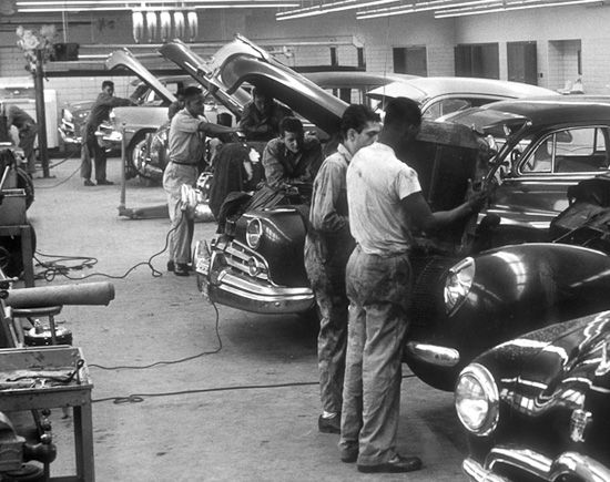 Mechanics working on vehicles in shop bays - Northwest Autoworks Chicago Northwest Side