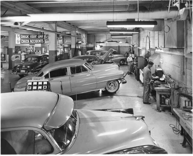 Auto repair shop bay with cars being serviced - Northwest Autoworks Chicago